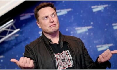 Elon Musk reacts with an emoji